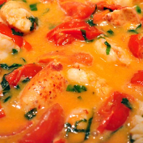 butter poached lobster and shrimp with tomatoes