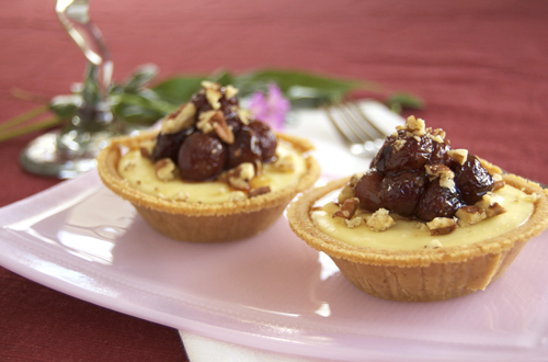 Goat cheese sweet potato cheesecakes with honey roasted grapes and pecans