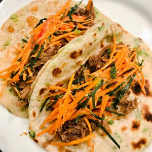 pulled pork scallion pancake tacos with pickles carrots